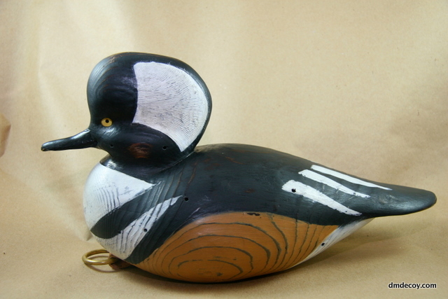 Simulated-antique merganser, left